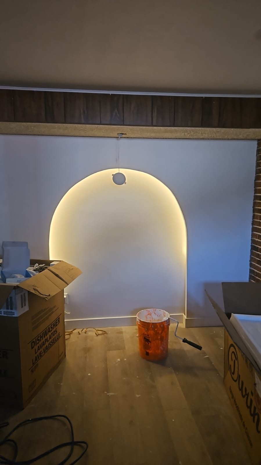 Arched feature wall after renovation with LED cove lighting in Calgary