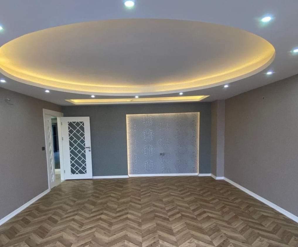 Custom oval cove ceiling with LED lighting in Calgary home