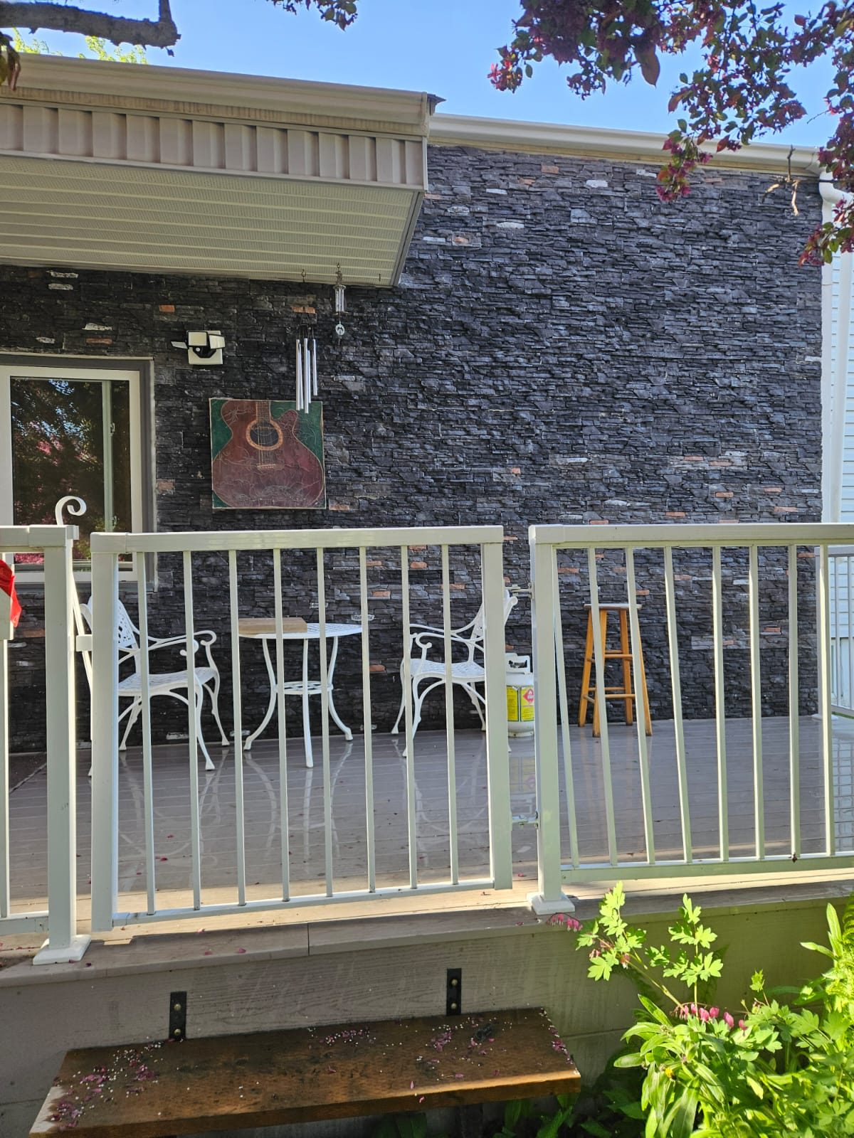 Finished stone veneer and deck railing, Calgary